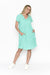 Woman wearing One Summer's Aqua Splash Taylor cotton Midi Dress with cap sleeves, pockets, lining and tuck detailing.