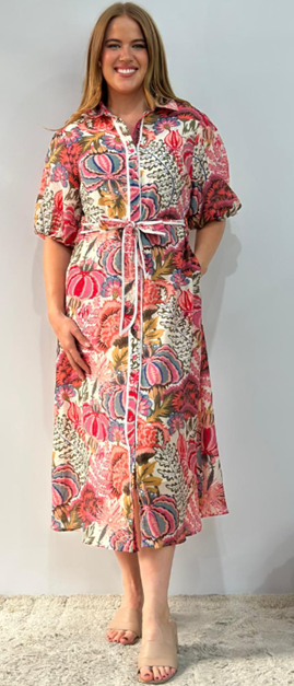 Woman wearing garden flower pink midi shirt dress from Sambara.