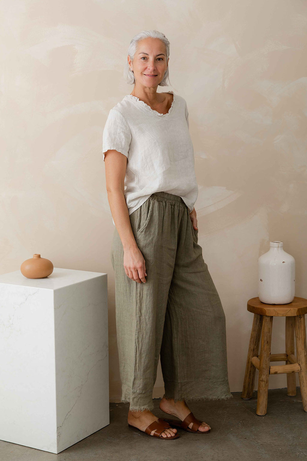 Model wearing Italian cartel tara linen wide leg pants in Sand / beige / natural