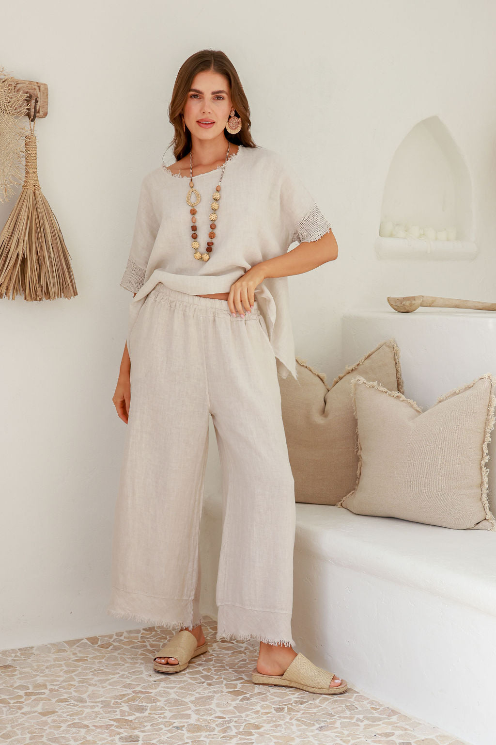 Model wearing Italian cartel tara linen wide leg pants in Sand / beige / natural