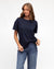 Woman wearing the white Tuck t-shirt with short sleeves, round neck, straight hem by Label of Love.