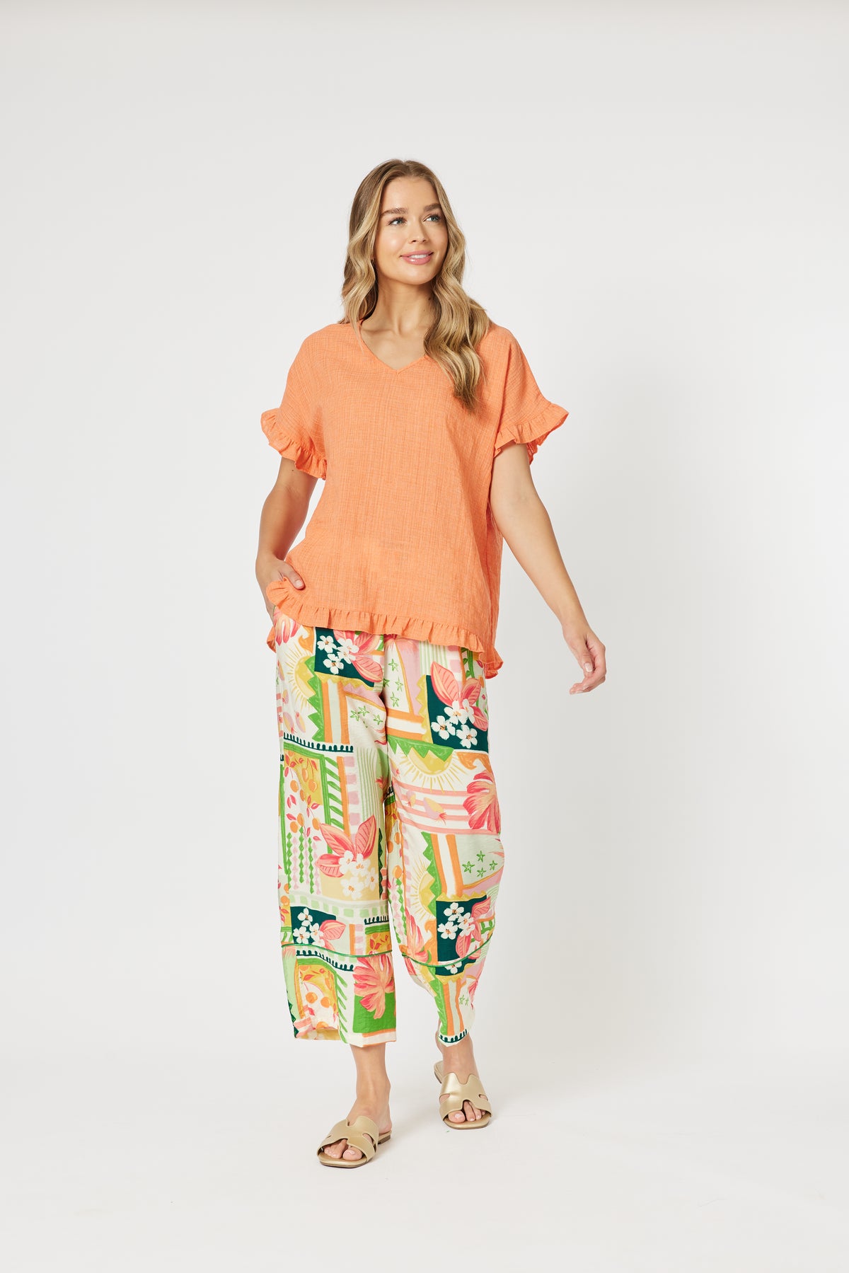 Women's Papaya orange v-neck top with frills by Threadz.