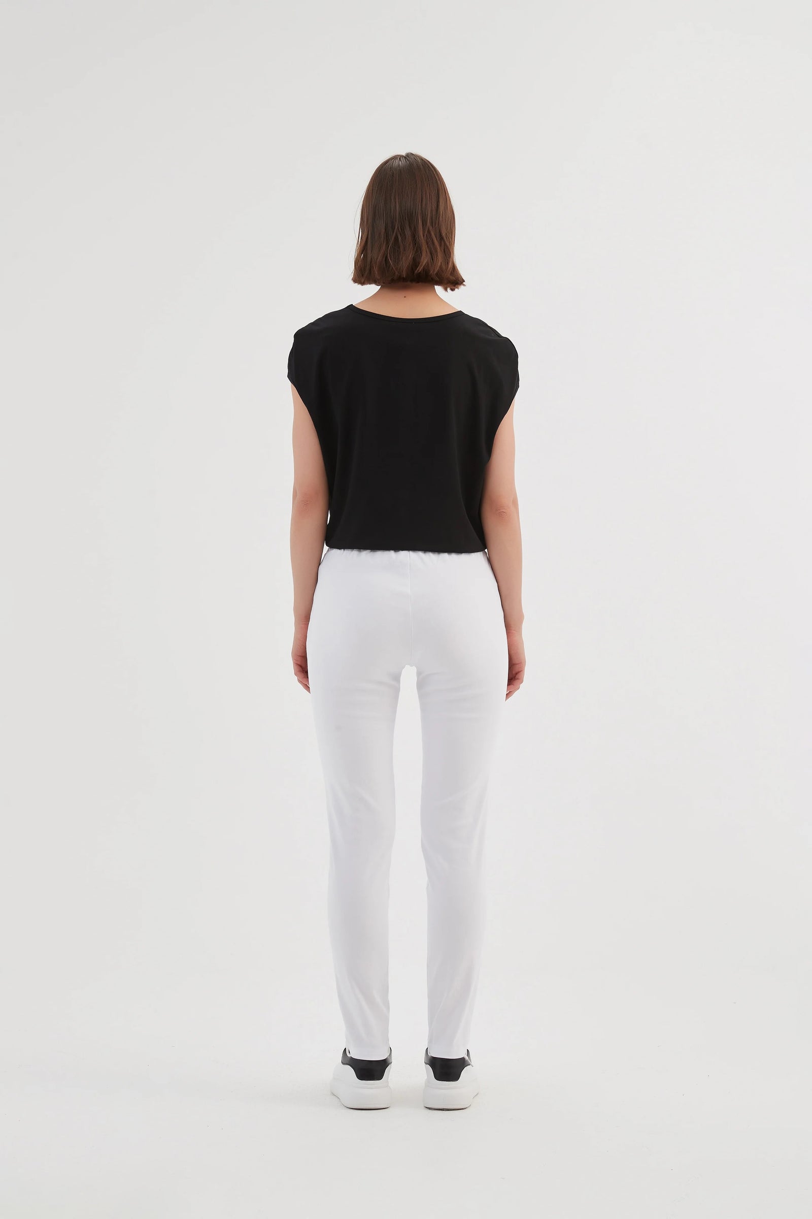 White ladies trousers in straight leg by Tirelli.