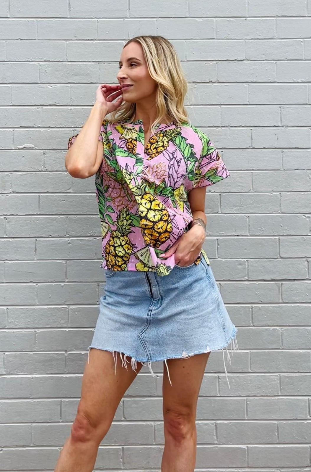 Model wearing Maude Vivante ladies Joy Top in Pineapple print. 